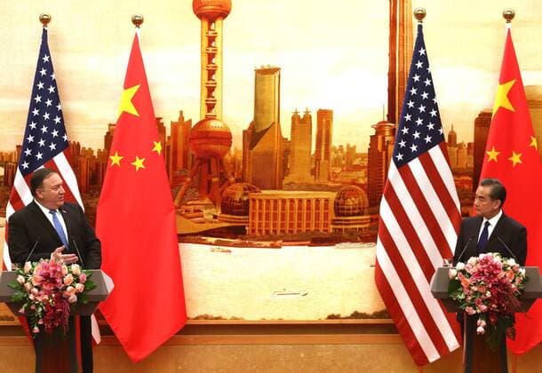 U.S. Secretary of State Mike Pompeo (L) and Chinese Foreign Minister Wang Yi hold a joint press conference after meeting earlier in the day in Beijing on June 14, 2018. Chinese President Xi Jinping told Pompeo that Washington and Beijing should make the most of bilateral mechanisms, amid escalating trade tensions between the world s biggest economies.  PEK2018061408 STEPHENxSHAVER