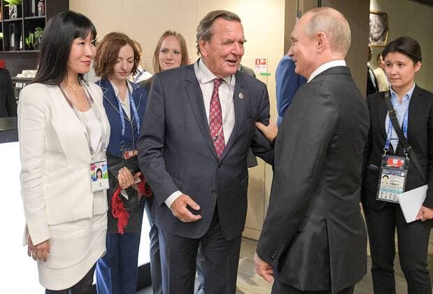 MOSCOW, RUSSIA â€“ JUNE 14, 2018: Russia s President Vladimir Putin, Gerhard Schroeder, Chairman of the Shareholders Committee with Nord Stream 2 AG and former German chancellor, and his wife Kim So-yeon (R-L) at the opening of the 2018 FIFA World Cup at Luzhniki Stadium. Alexei Druzhinin Russian Presidential Press and Information Office TASS  TS0843FF