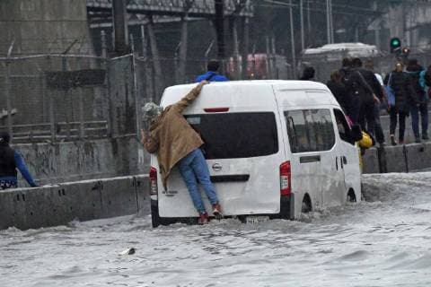 June 14, 2018 - EUM20180614ACT05.JPG.CIUDAD DE MEXICO.- RainsLluvias-CDMX.- 14 de junio 2018. Por segundo dia consecutivo se registraron fuertes lluvias en la Ciudad de Mexico, ahora provocando afectaciones en el oriente, lo que causo la suspension del servicio de algunas estaciones de la Linea A del Sistema de Transporte Colectivo (STC) Metro. Foto: Agencia EL UNIVERSALAlan Rodriguez  - ZUMAu78_ 20180614_zaf_u78_626 Copyright: xElxUniversalx