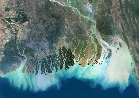 Satellite image of the Ganges River Delta, Bangladesh, India. Also known as the Brahmaputra Delta, it empties into the Bay of Bengal. Kolkata sits within the lower Ganges Delta along the Hooghly River (at west on the image). Image collected on March 16, 2017 by Sentinel-2 satellites. 913_03_PO07688