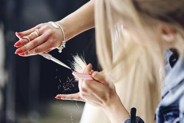 Close-up of hairdresser cutting woman s hair model released Symbolfoto property released  ABIF00356