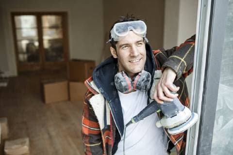 Portrait of a handyman renovating flat model released Symbolfoto property released  PESF01096