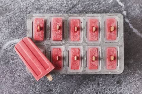 Homemade strawberry ice lollies in tray  RTBF01247