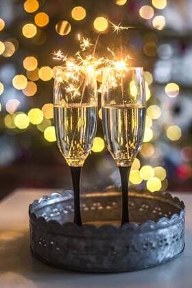Two champagne glasses and sparklers in front of Bokeh  SARF03749