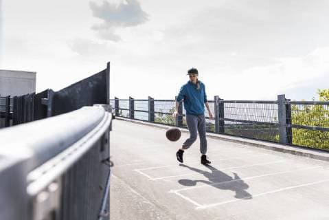 Man dribbling with basket ball model released Symbolfoto  UUF13634