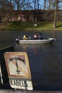 - BRUGGE, BELGIUM: Illustration picture shows divers and police during the search for Frederic Coopman, Tuesday 13 December 2011 in the Ringvaart river in Brugge. 20 year old student Coopman has been missing since he left a party on Saturday, his gray woolen hat and one of his black gloves were found at the Gentpoort in Brugge. KURTxDESPLENTER x31604196x