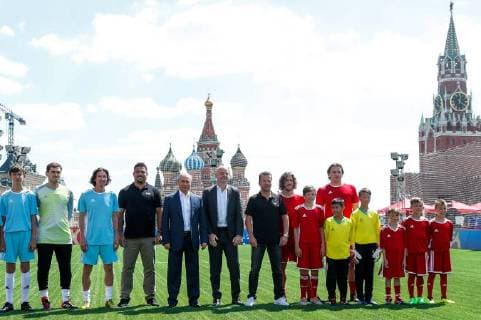 MOSCOW, RUSSIA - JUNE 28, 2018: 2018 FIFA World Cup Ambassador Alexei Smertin (3rd L), Russia s President Vladimir Putin (5th L), FIFA President Gianni Infantino (6th L), and football players visit the 2018 FIFA World Cup Football Park in Red Square. Mikhail Metzel TASS  TS086D60