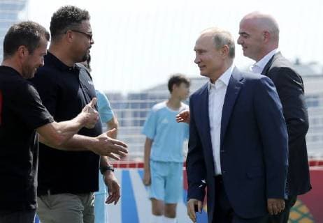 MOSCOW, RUSSIA - JUNE 28, 2018: German football player Lothar Matthaus, Brazilian football player Ronaldo Luiz, Russia s President Vladimir Putin, and FIFA President Gianni Infantino (L-R front) visit the 2018 FIFA World Cup Football Park in Red Square. Mikhail Metzel TASS  TS086DB6