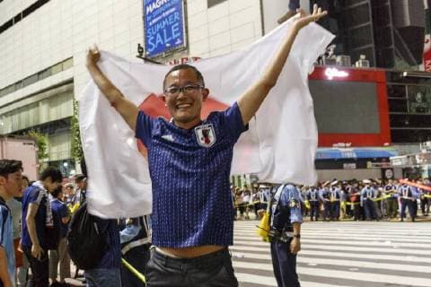 June 29, 2018 - Tokyo, Japan - Japanese soccer fans celebrate in Shibuya after their team advanced to the second round of World Cup in Tokyo, Japan. Japan s Soccer National Team. Japan sealed their position to the second round of the FIFA World Cup despite losing to Poland 1-0 in Volgograd Arena in Volgograd, Russia. Soccer fans who watched the game in Tokyo gathered in Shibuya s famous scramble crossing to celebrate, the Tokyo Metropolitan Police were on hand to control access. Tokyo Japan - ZUMAm191 20180629_zap_m191_002 Copyright: xRodrigoxReyesxMarinx