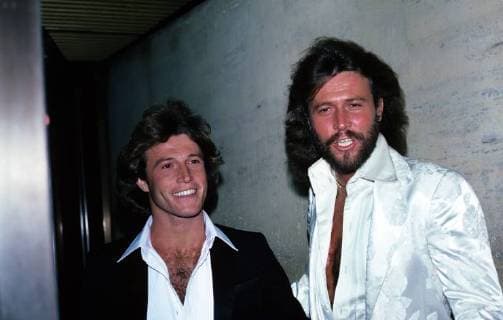 Andy Gibb and Barry Gibb of the Bee Gees are photographed at a Grammy Party held at the Four Seasons in the 1990s. © Nancy Barr Brandon MediaPunch Copyright: xNancyxBarrxBrandonx xMediaPunchx