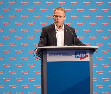 30.06.2018, xomx, Politik, AFD Parteitag in Augsburg, emwir empoli v.l. Dr. Christian Blex am Rednerpult. Portrait Portraet Einzelbild. Es geht um die Syrien Resolution. Politik, AFD Parteitag in Augsburg