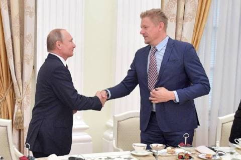 MOSCOW, RUSSIA â€“ JULY 6, 2018: Russia s President Vladimir Putin (L) shakes hands with retired Danish footballer Peter Schmeichel (R) meet with football stars at the Moscow Kremlin. Alexei Druzhinin Russian Presidential Press and Information Office TASS  TS088267