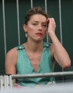 LONDON, ENGLAND - JULY 07: it s official THEY HAVE THEIR FIRST KISS Amber Heard wearing a low cut mint jumpsuit with new boyfriend Vito Schnabel attend day seven of the Wimbledon Tennis Championships at the All England Lawn Tennis and Croquet Club on July 7, 2018 in London, England..People: Vito Schnabel and Amber Heard London England - ZUMAs214 20180709_zba_s214_026 Copyright: xSMGx
