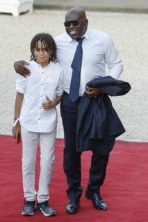 Wilfried Mbappe (father of Kylian Mbappe) et son fils Ethan Mbappe (brother of Kylian Mbappe) FOOTBALL : Equipe de France de Football recu au Palais de l Elysee - Paris - 16 07 2018 StephaneAllaman Panoramic 