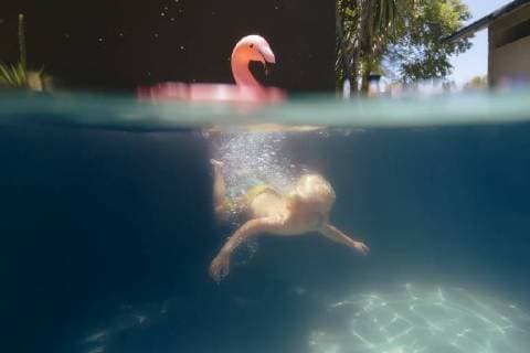 Underwater view of single blonde boy swimming in pool, Canggu Bali Indonesia TRKO021205 model released Symbolfoto Copyright: KonstantinxTrubavin TRKO021205