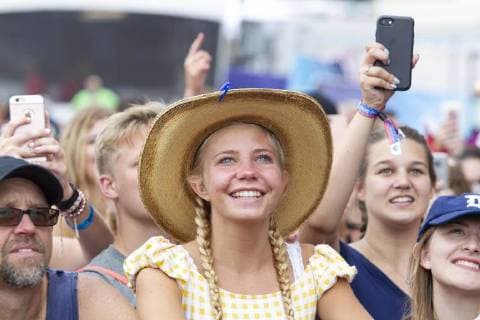 July 21, 2018 - Brooklyn, Michigan, U.S - A fan watches WALKER HAYES perform at the Faster Horses Country Music Festival. Brooklyn U.S. - ZUMAm242 20180721_zap_m242_005 Copyright: xScottxMapesx