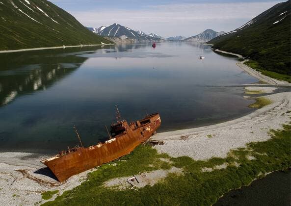 KAMCHATKA TERRITORY, RUSSIA â€“ JULY 9, 2018: A rusty Soviet whaling ship in the Morzhovy Ugol Bay off Shipunsky Peninsula. Yuri Smityuk TASS  TS08A993