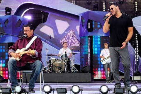 BAKU, AZERBAIJAN - JULY 26, 2018: Actor Steven Seagal (L) and Crocus Vice President, singer Emin Agalarov ahead of the opening of the Zhara music festival at the Sea Breeze Resort hotel. Vyacheslav Prokofyev TASS  TS08AC89
