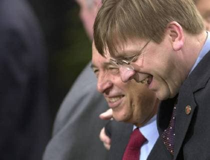 BRU26 - - BARCELONA, SPAIN: Belgian PM, Guy Verhofstadt (R) chats with Greek PM Constantinos Simitis after the heads of state and Foreign Ministers family picture, Saturday 16 March 2002 in Barcelona as they attended the two- day work meeting of the EU summit in Barcelona . EU leaders, in a compromise with France, agreed on the principle of opening electricity and gas markets in 2004 for all commercial European consumers. BENOITxDOPPAGNE  x879302x