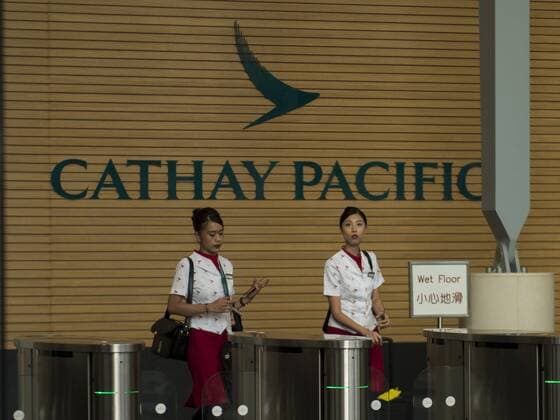 Hong Kong: Cathy Pacific job cuts A photo showing a employee’s of the Hong Kong base Cathay Pacific airways leaving the Company’s Headquarters in Hong Kong, China. 31 JULY 2018. Cathay Pacific has issues and internal memo telling staff to prepare for restructuring in the company , Cathay has plans to cut Overseas job in hoping that it will help Cathay turn a Profit , the Company has 7,600 staff in 100 locations outside Hong Kong, The Hong Kong base airline has already gone through a major staff cut last may at its head office which slashed 600 jobs , this was the first step in a three year exercise and to spent HK$ 224 million on restructuring , this is an effort to turn a profit which the company has been seeing a great loss on their yearly financial report. Hong Kong  VernonxYuen