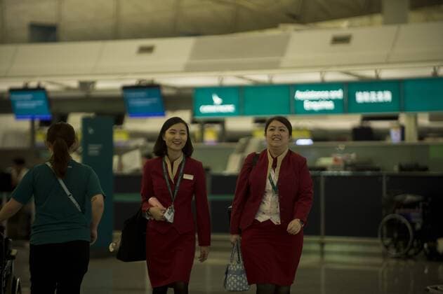 Hong Kong: Cathy Pacific job cuts A photo showing an employee of the Hong Kong Base Cathay Pacific airways walking in Hong Kong international Airport in Hong Kong, China. 31 JULY 2018. Cathay Pacific has issues and internal memo telling staff to prepare for restructuring in the company , Cathay has plans to cut Overseas job in hoping that it will help Cathay turn a Profit , the Company has 7,600 staff in 100 locations outside Hong Kong, The Hong Kong base airline has already gone through a major staff cut last may at its head office which slashed 600 jobs , this was the first step in a three year exercise and to spent HK$ 224 million on restructuring , this is an effort to turn a profit which the company has been seeing a great loss on their yearly financial report. Hong Kong  VernonxYuen