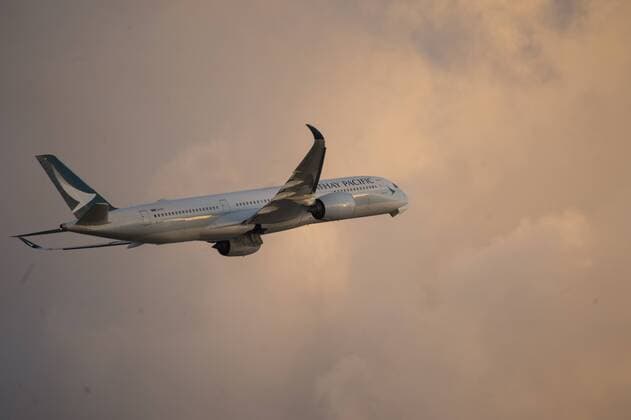 Hong Kong: Cathy Pacific job cuts A photo showing a Cathay Pacific airways A350 taking-off in Hong Kong International Airport in Hong Kong, China. 31 JULY 2018. Cathay Pacific has issues and internal memo telling staff to prepare for restructuring in the company , Cathay has plans to cut Overseas job in hoping that it will help Cathay turn a Profit , the Company has 7,600 staff in 100 locations outside Hong Kong, The Hong Kong base airline has already gone through a major staff cut last may at its head office which slashed 600 jobs , this was the first step in a three year exercise and to spent HK$ 224 million on restructuring , this is an effort to turn a profit which the company has been seeing a great loss on their yearly financial report. Hong Kong  VernonxYuen
