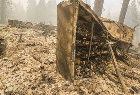 August 6, 2018 - Dardnelle, California, U.S.A - A cooler box that held beer at the Daranelle Resort store stands with its surroundings destroyed after a wind whipped fire exploded in the area Sunday evening Aug. 5, 2018. As of Monday Aug. 6, 2018 the Donnell Fire in Tuolumne County has grown to 11,074 Acres according to the U.S. Forest Service. Dardnelle U.S.A - ZUMAbk2_ 20180806_zaf_bk2_005 Copyright: xMartyxBicekx
