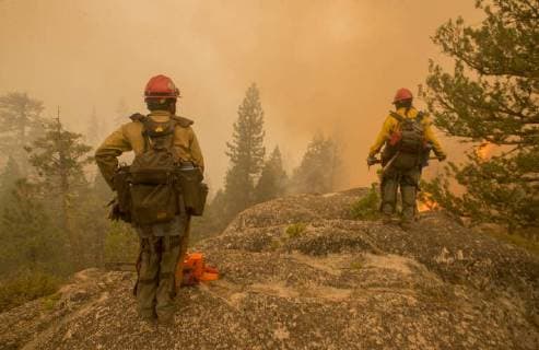 August 6, 2018 - Dardnelle, California, U.S. - U.S. Forest Service, Stanislaus HotShots watch over Camp Jack Hazard Monday, as they light back fires to give the camp a safety zone as the Donnell Fire approaches. The Donnell Fire in Tuolumne County has grown to 11,074 Acres according to the U.S. Forest Service. Dardnelle U.S. - ZUMAbk2_ 20180806_zaf_bk2_018 Copyright: xMartyxBicekx