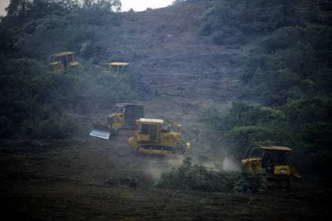 August 6, 2018 - Ukiah, California, USA - Ukiah, California, U.S. - Fire fighting bull dozers build wide containment lines along a fire road on the eastern edge of the Ranch fire, the largest of the two fires that make up the Mendocino Complex. Ukiah USA - ZUMAw332 20180806_zap_w332_003 Copyright: xNealxWatersx