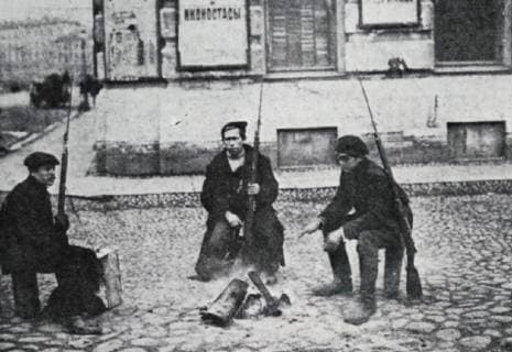Photograph of soldiers sitting with their guns in the street during the February Revolution of 1917. Dated 20th Century WorldxHistoryxArchive 917_05_WHA_094_0670