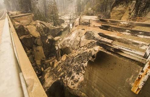 August 7, 2018 - Dardanelle, California, U.S. - The Historic Dardanelle Bridge built in 1933 was no match for the Donnell Fire as it burned at the Middle Fork of the Stanislaus River with the remains hanging into the river. The Donnell Fire in Tuolumne County has increased to 11,344 acres according to the U.S. Forest Service with 2 percent containment. With the lack of resources the fire continues to grow. Dardanelle U.S. - ZUMAbk2_ 20180807_zaf_bk2_009 Copyright: xMartyxBicekx