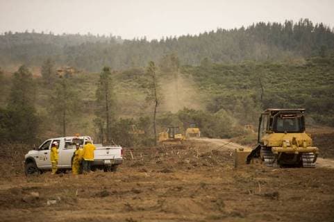 CalFire personnel use bulldozers to create a fire break along a ridge in Colusa County, California on August 7, 2018. The Mendocino Complex fire has become the largest in the state s history.  SXP2018080728 TERRYxSCHMITT
