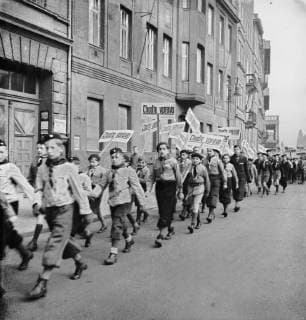 Members of the Scout march with banners with the inscription Go Right in Prague, Protectorate of Bohemia and Moravia, Czechoslovakia, March 26, 1939. Right hand traffic was introduced in Prague on March 26, 1939. (CTKxPhoto) CTKPhotoFO00519522 
