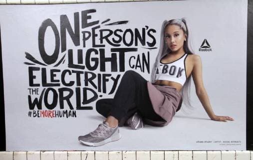 NEW YORK, NY August 11: ***EDITORIAL USE ONLY*** Ariana Grande in Reebok new ad Reebok Be More Human-Celebrating Powerful Women at West 4th Street Subway Station in New York. August 11, 2018 Copyright: xRWx