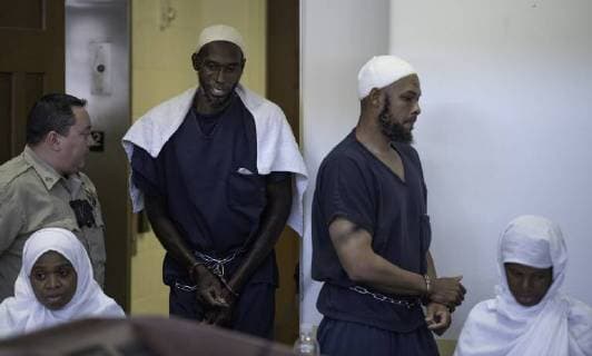 August 13, 2018 - Taos, NM, U.S. - Albuquerque Journal.hearing for the five adults charged with child abuse in the Amalia compound case were in court Monday afternoon to see judge Sarah C. Backus. Pictured from left to right are: Jany Leveille(Cq) Lucas Morton(Cq) Siraj Wahhaj(Cq) and Subhannah Wahhaj(Cq). All suspects were release from jail. .Taos, New Mexico Albuquerque Journal Taos U.S. - ZUMAab1_ 20180813_zaf_ab1_012 Copyright: xRobertoxE.xRosalesx
