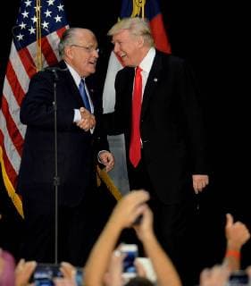 August 18, 2016 - Charlotte, NC, USA - Former New York City mayor Rudy Giuliani, left, welcomes Republican presidential candidate Donald Trump on stage during a campaign rally on Aug. 18, 2016, at the Charlotte Convention Center in Charlotte, N.C. Charlotte USA - ZUMAm67_ 20160818_zaf_m67_092 Copyright: xJeffxSinerx