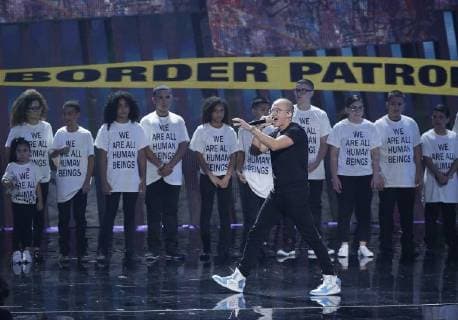 Logic is backed by children wearing We are all human beings shirts during the 35th annual MTV Video Music Awards at Radio City Music Hall in New York City on August 20, 2018.  NYP20180820113 JOHNxANGELILLO