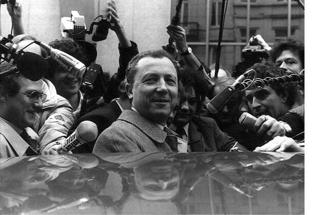 BRUSSELS ---- FRENCH MINISTER OF FINANCE JACQUES DELORS IS SURROUNDED BY REPORTERS AS HE LEAVES THE MEETING OF EEC FINANCE MINISTERS MARCH 2O. THE MINISTERS ARE DISCUSSING A REALIGNMENT OF THE EMS CURRENCIES. .JEP WST BELGA.  x317258x
