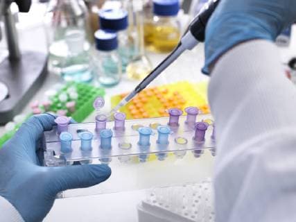 Research experiment, scientist pipetting sample into vials model released Symbolfoto property released  ABRF00148