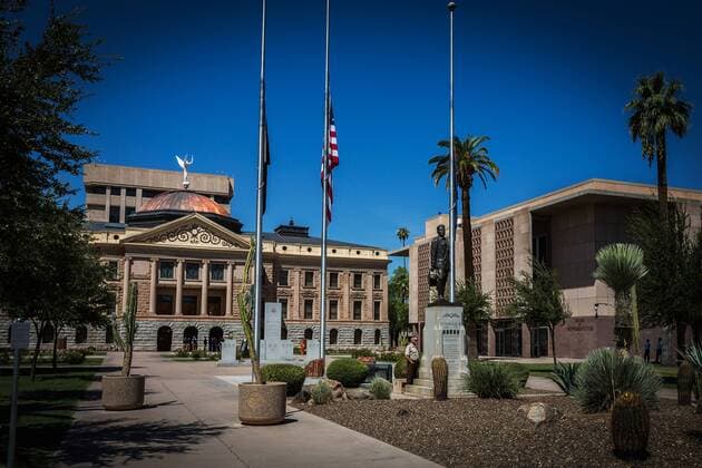 August 28, 2018 - Phoenix, Arizona, U.S - Flags fly at half-staff for former Arizona Senator John McCain outside the Arizona State Capitol building. Senator McCain died Saturday August 25, 2018 from brain cancer at the age of 81. Phoenix U.S. - ZUMAj112 20180828_zap_j112_010 Copyright: xDougxJamesx