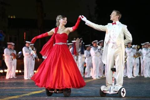 MOSCOW, RUSSIA â€“ AUGUST 31, 2018: A couple dancing at 2018 Spasskaya Tower International Military Music Festival, in Moscow s Red Square. Marina Lystseva TASS  TS08E94A