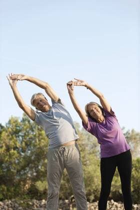 Senior couples stretching outdoors  Copyright: OdilonxDimier B41401021