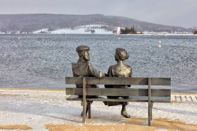 statue of Alexander Graham Bell and his wife in winter, Baddeck, Cape Breton, Nova Scotia, Canada  acp115368 Barrettx&xMackay