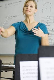 Music teacher conducting  Copyright: MichèlexConstantini B66297906