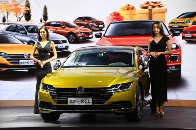 (180913) -- QINGDAO, Sept. 13, 2018 -- Models show a vehicle during the Auto Qingdao Autumn 2018 in Qingdao, east China s Shandong Province, Sept. 13, 2018. Over 600 exhibitors participated in the six-day auto show. )(mcg) CHINA-SHANDONG-QINGDAO-AUTO SHOW (CN) LixZiheng 
