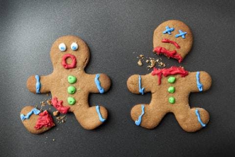 A shocked gingerbread man with broken leg next to a decapitated gingerbread man  Copyright: Epoxydude fStopImages1251014