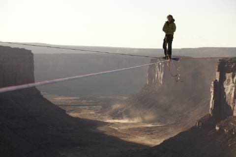 Andy Lewis highlining in Moab Utah, Moab Utah United States Copyright: JaredxAlden 4517100004