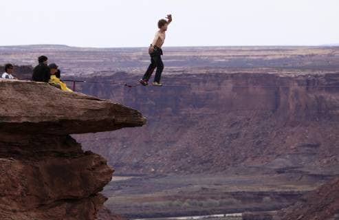 Andy Lewis highlining at the Fruit Bowl in Moab, Utah., Moab Utah United States Copyright: JaredxAlden 4517100013