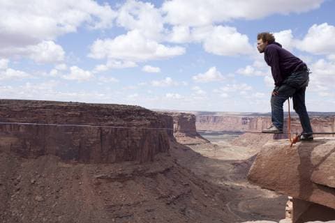 Andy Lewis highlining at the Fruit Bowl in Moab, Utah., Moab Utah United States Copyright: JaredxAlden 4517100014