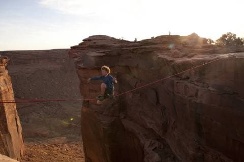 Andy Lewis preparing to cut his highline with a knife in the film Sketchy Andy, Fruit Bowl Moab Utah, Boulder Colorado United States Copyright: JaredxAlden 4517100024